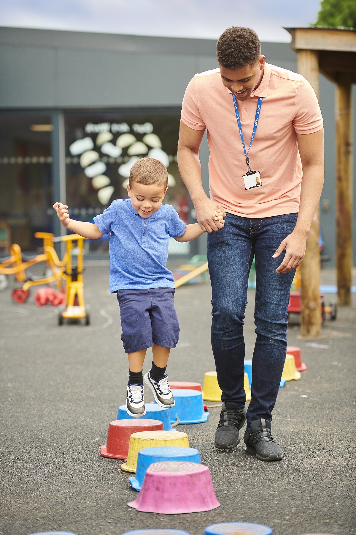 Man helping a child play